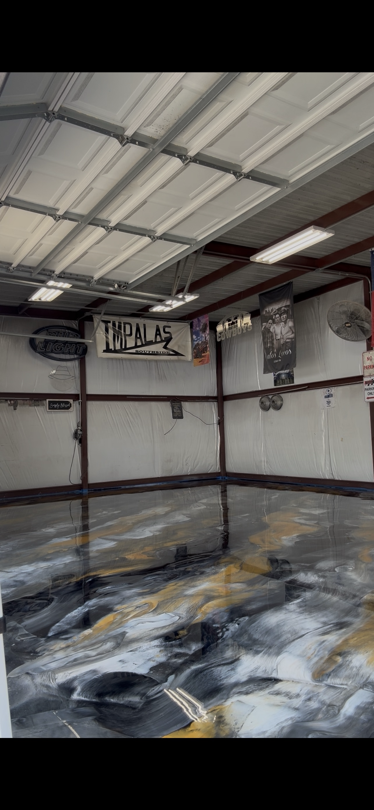 Finished black silver and gold metallic epoxy floor